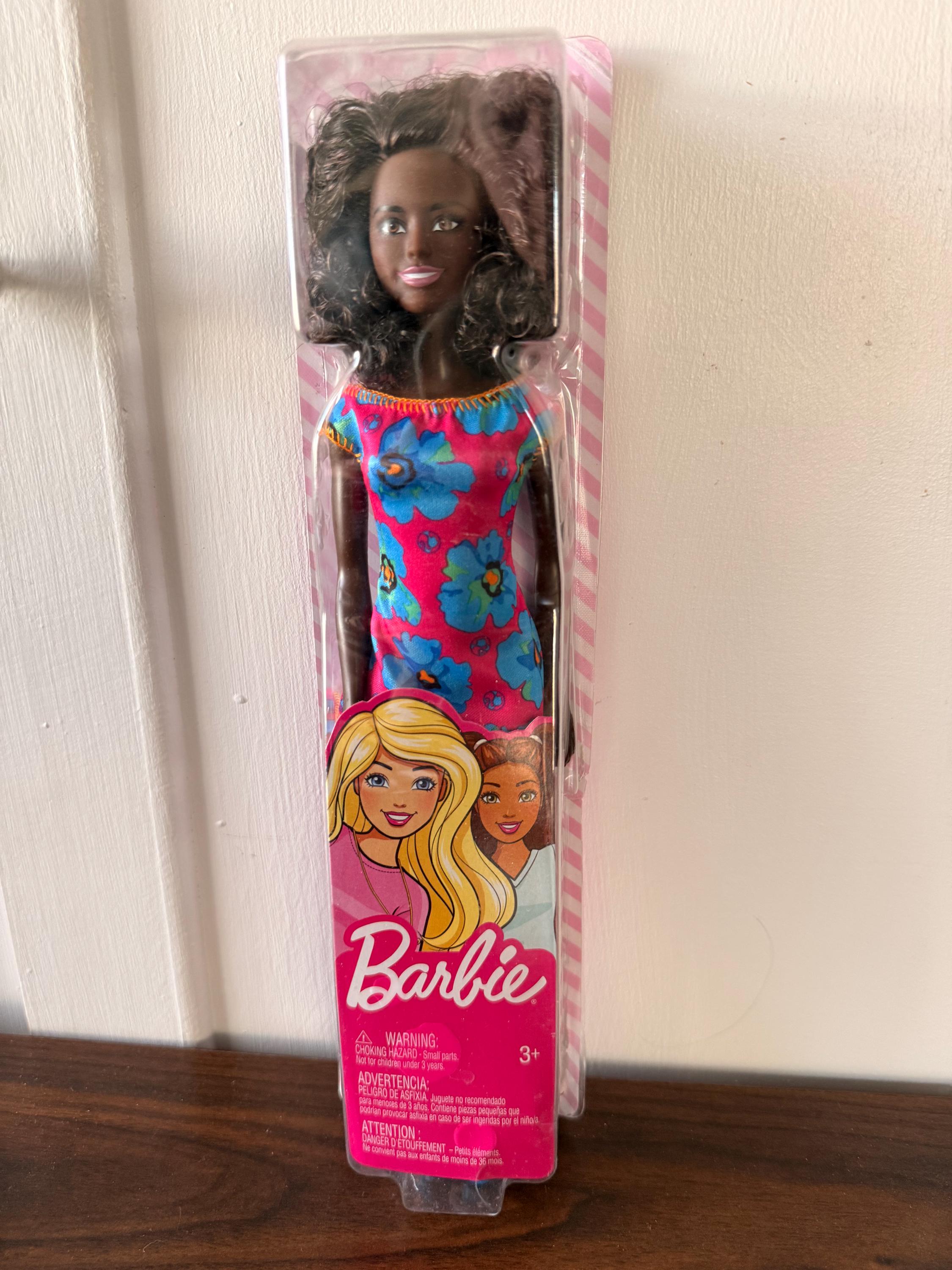 NIB Black Matel Barbie Doll with Floral Dress