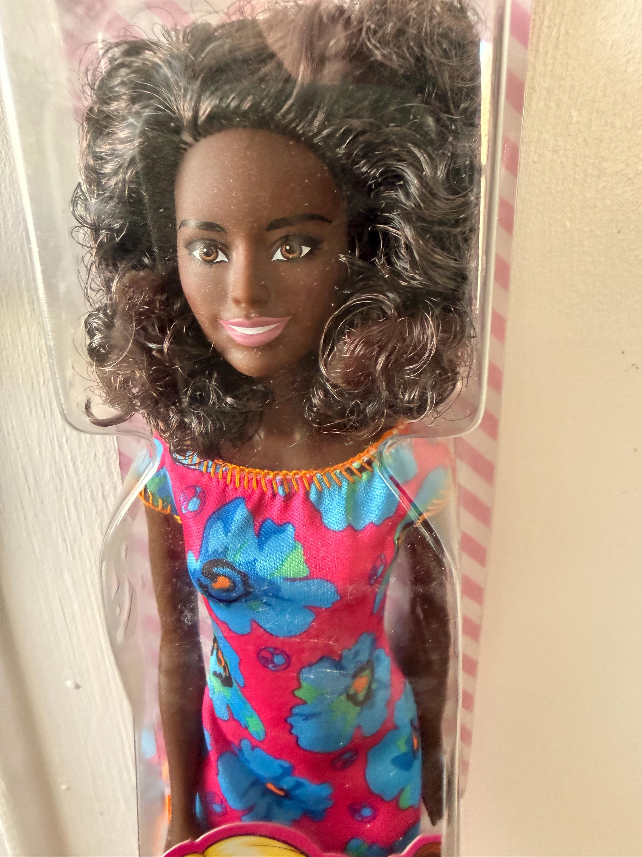 NIB Black Matel Barbie Doll with Floral Dress